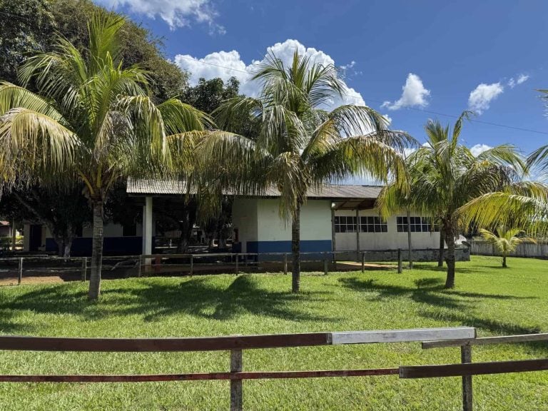 Belo Sun Mining community center facility surrounded by palm trees and landscaped lawns.