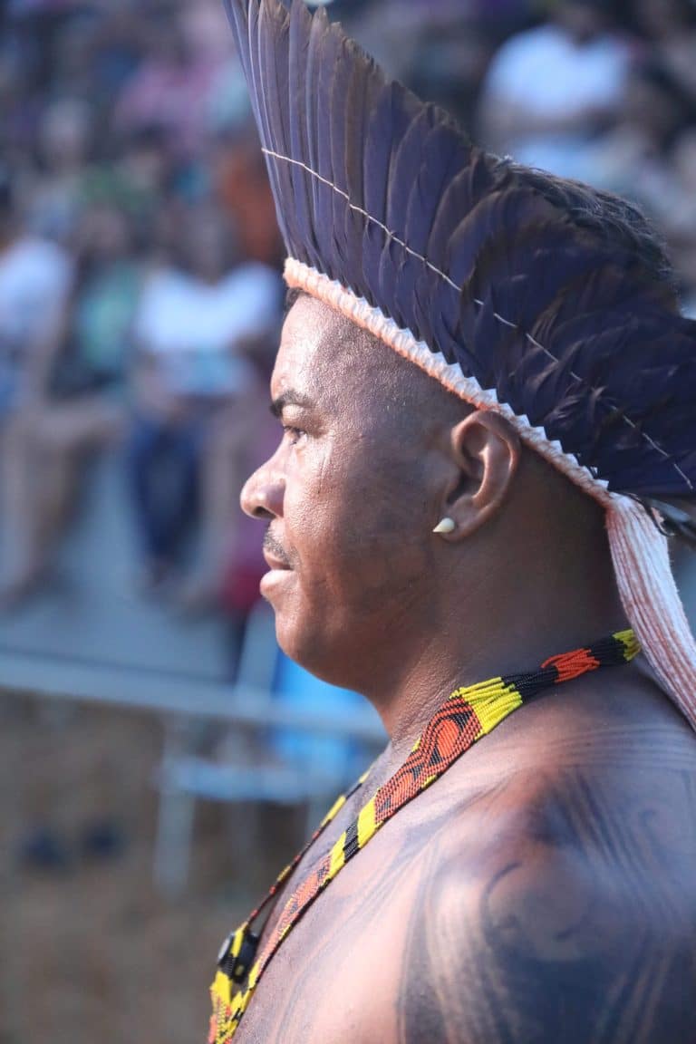 Indigenous community member wearing traditional headdress during a Belo Sun Mining cultural outreach program.