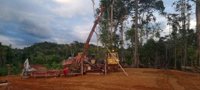 Drilling rig operating at a forest clearing construction site