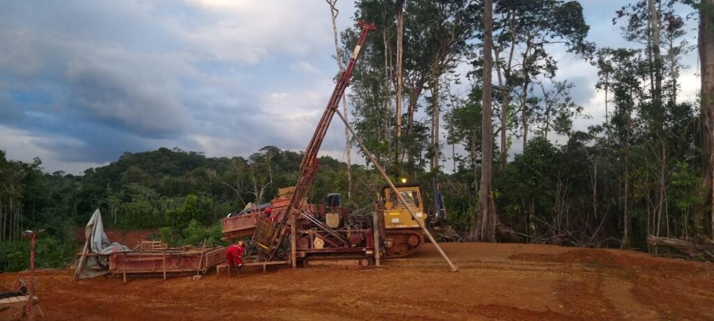 Drilling rig operating at a forest clearing construction site