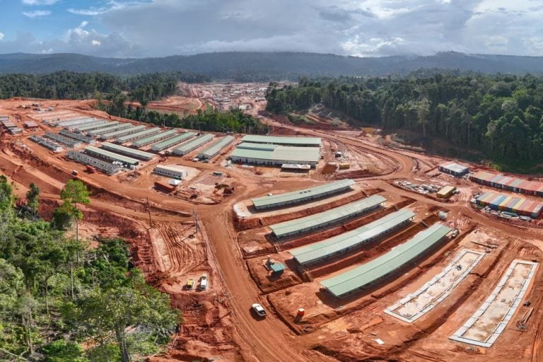 High-angle aerial view of a large residential mining camp and support facilities at an Endeavour Mining gold operation site in West Africa.