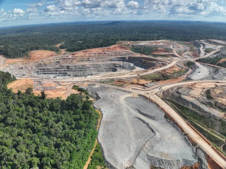 Wide aerial view of an open-pit gold mining operation and haul roads managed by Endeavour Mining in West Africa.