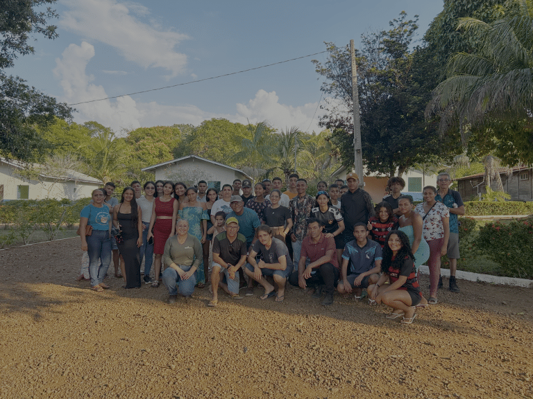 Group of local community members posing outdoors during a Belo Sun Mining engagement event.